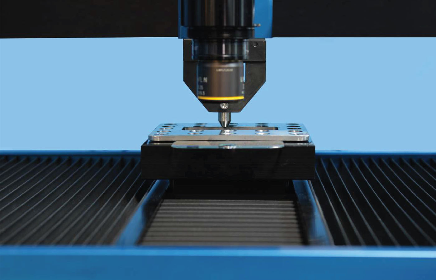 Screen protector sample undergoing scratch test on NANOVEA PB1000 mechanical tester