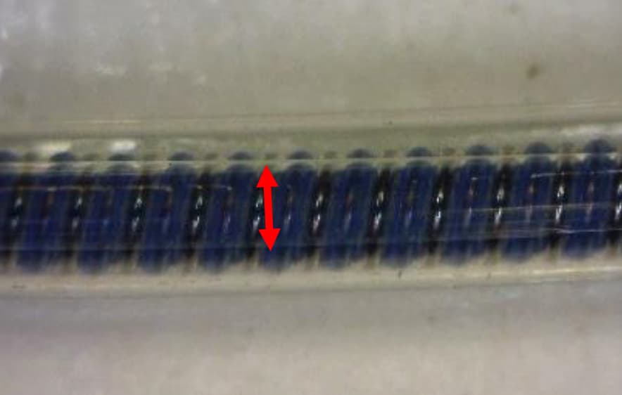 Polyether-polyurethane pacing lead surface after wear testing showing a smaller wear scar