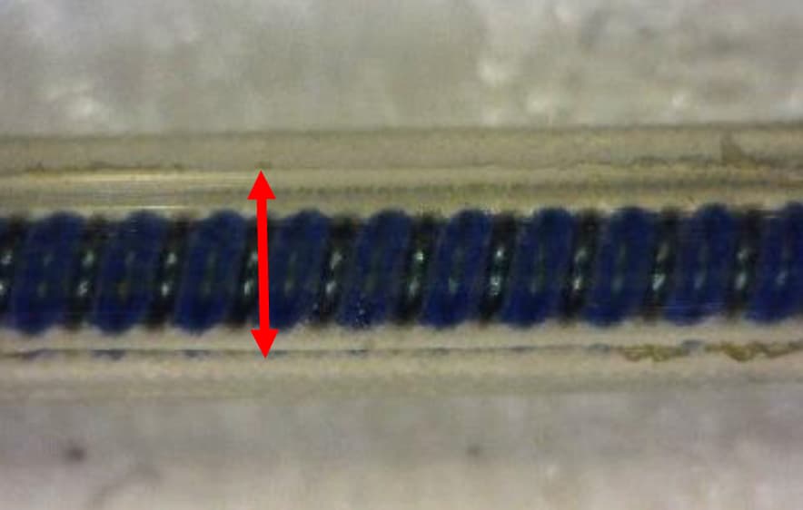 Silicone pacing lead surface after wear testing showing a large wear scar